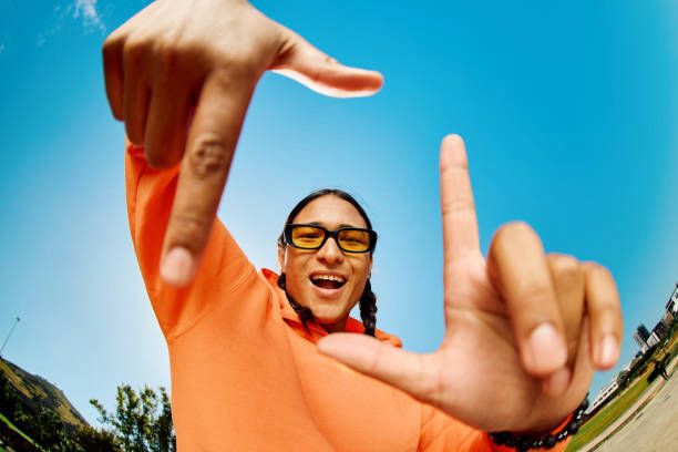 Creator smiling outdoors